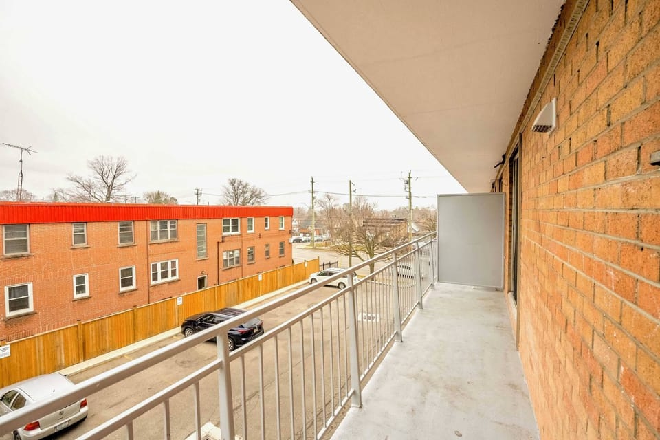 Spacious Balcony With A View Of The Neighborhood And Ample Space To Relax
