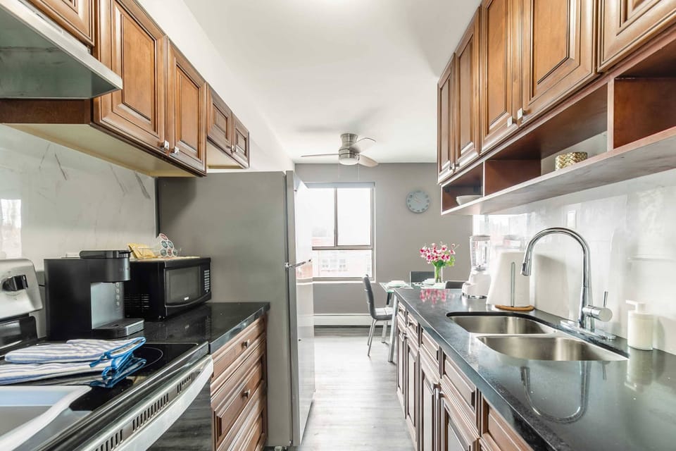 Fully Equipped Kitchen With Modern Appliances And Sleek Countertops