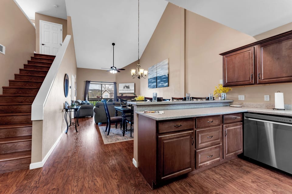 Large and modern kitchen well stocked with necessities to do meal prep. 