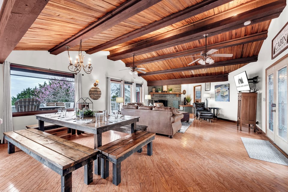 Large living room with vaulted cedar ceiling and lake views