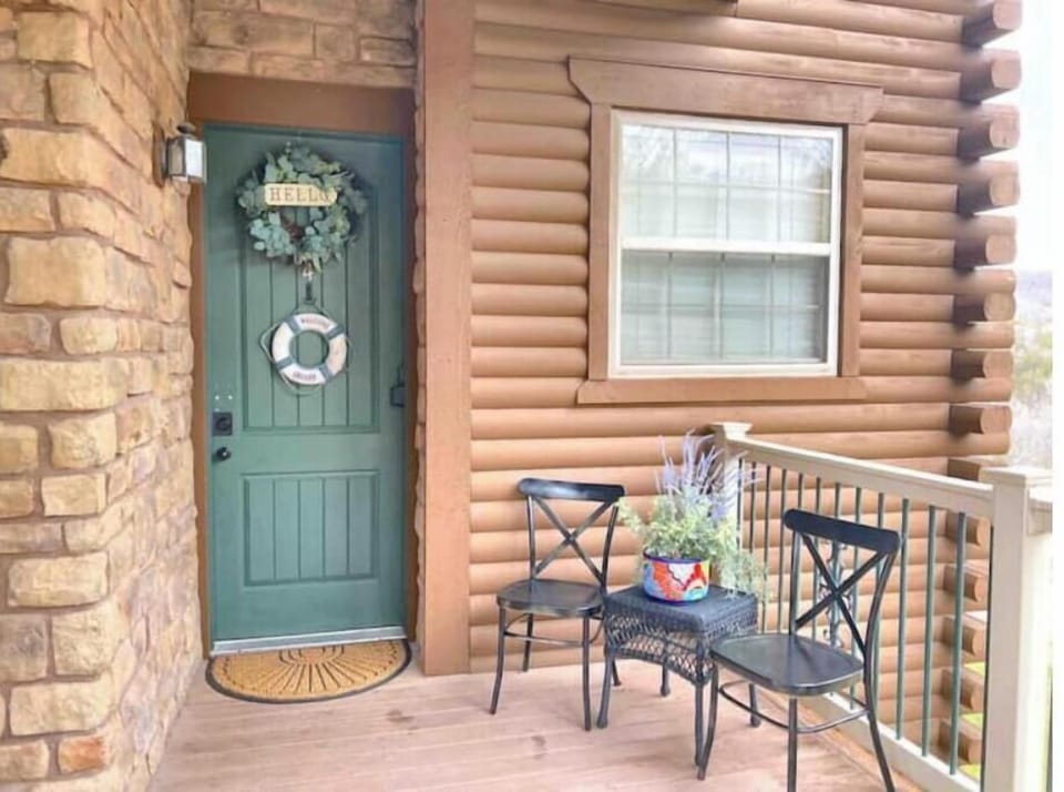 Condo entrance, there is ramp and a set of stairs.