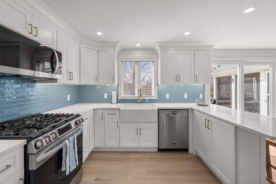 Fully stocked kitchen with new appliances, gas range, farmer`s sink, breakfast bar, and coffee nook.