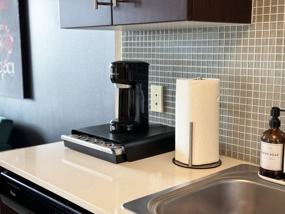 Enjoy extended comfort with our fully equipped kitchen, complete with a coffee machine, stovetop, and microwave—a perfect setup for your long-term stay.