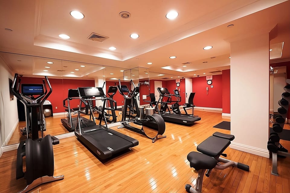 Energize your morning in a bright, well-equipped fitness room
