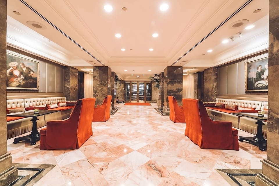 Step into a grand marble lobby glowing with elegance.