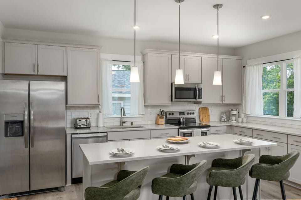 Kitchen is fully equipped with modern appliances and with ample counter spaces