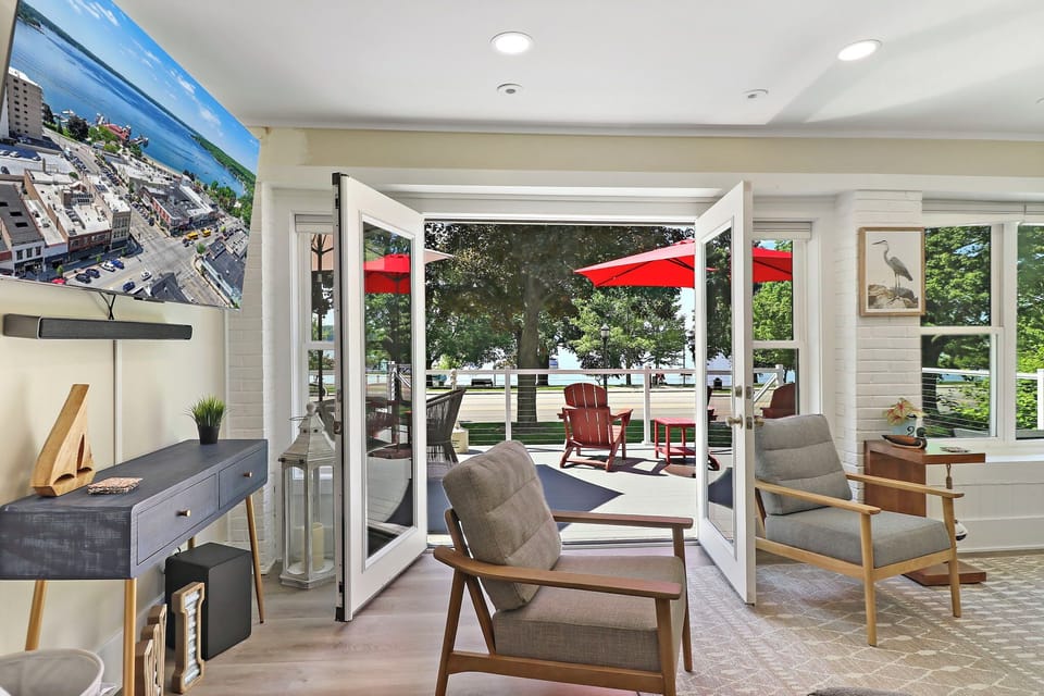 Living room with smart TV and Queen sofa sleeper. Entrance to furnished front deck.