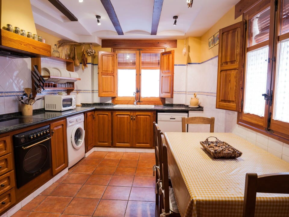 Cabinetry, Property, Countertop, Furniture, Window, Wood, Kitchen Appliance, Interior Design, Kitchen Stove, Lighting