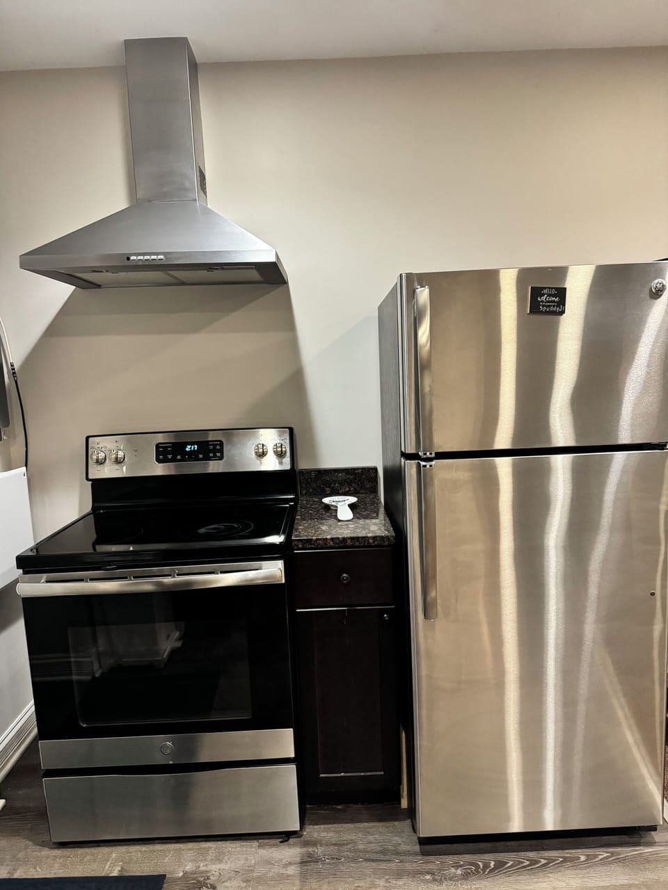 Stove, oven, and full-size refrigerator.