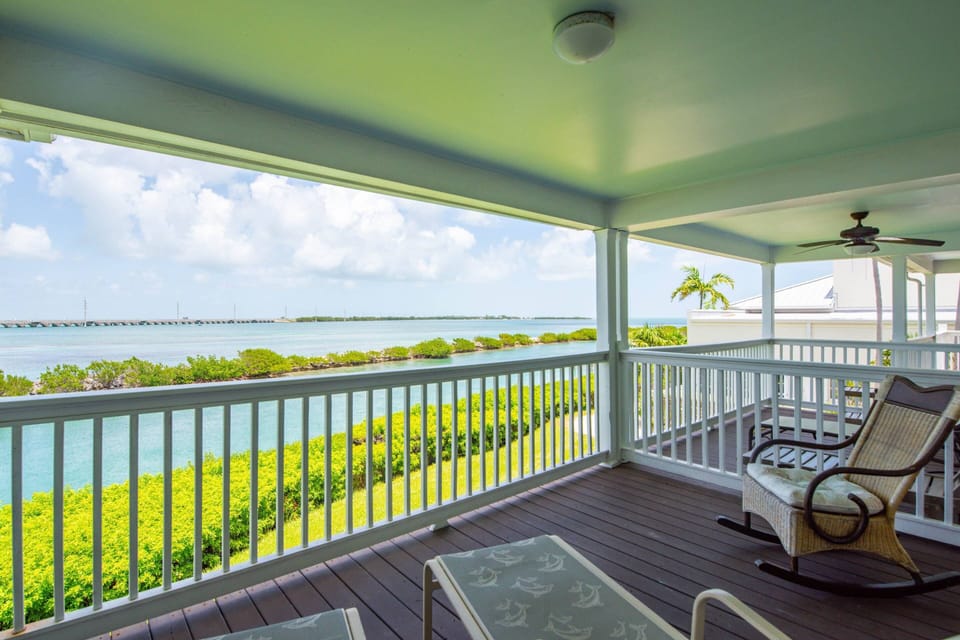 The second-floor back deck offers unparalleled open water views, providing a breathtaking panorama of the surrounding Florida Keys.