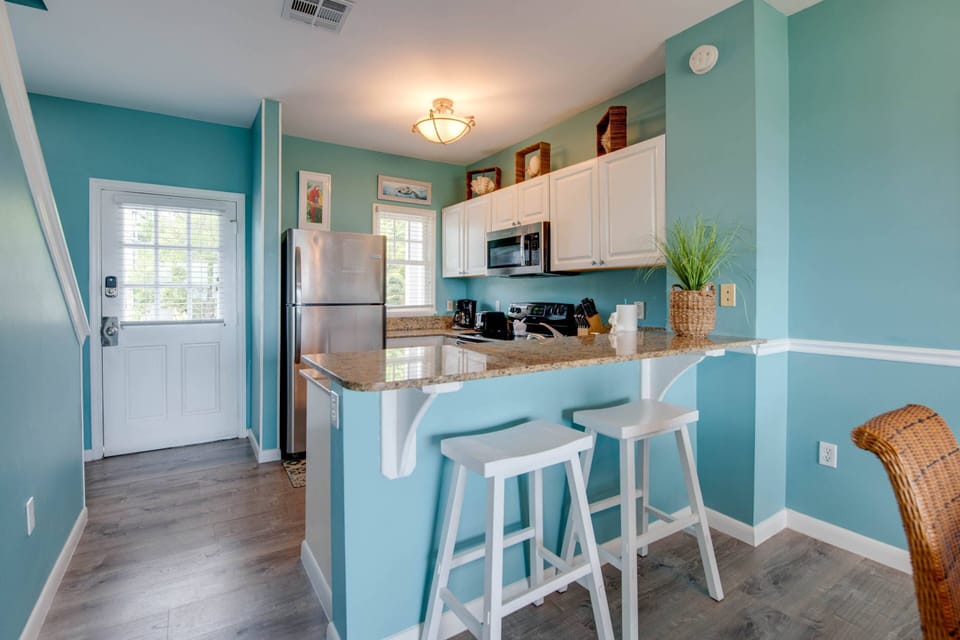 The kitchen at Water View Keys Retreat features convenient seating for 2 at the counter, ideal for casual meals or enjoying a morning coffee together.