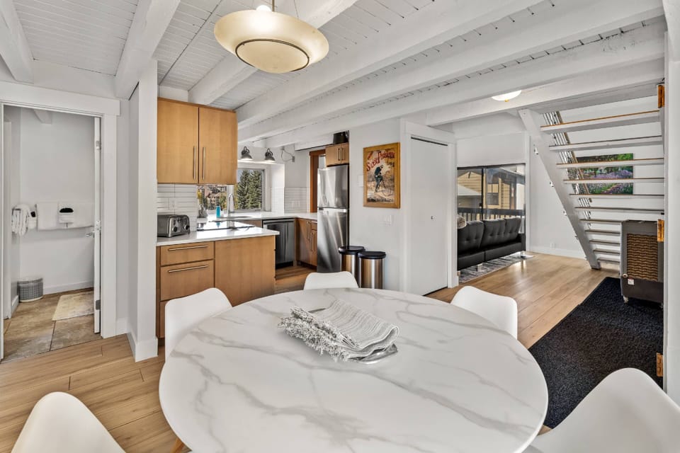 Dining, area with views into kitchen, and first floor bathroom.