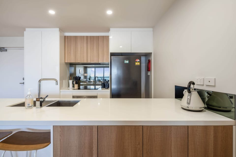 Modern kitchen featuring quality appliances and generous bench space