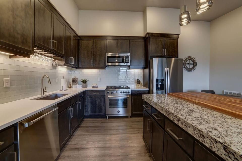 Modern luxurious kitchen with island bar and deluxe appliances