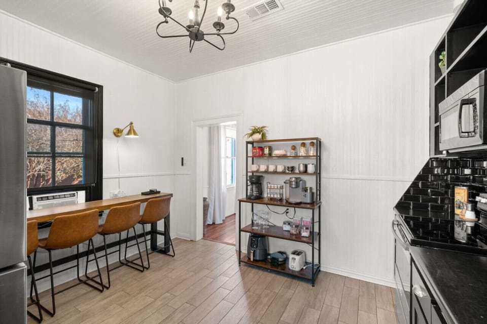 Fully stocked with cookware and pantry space.