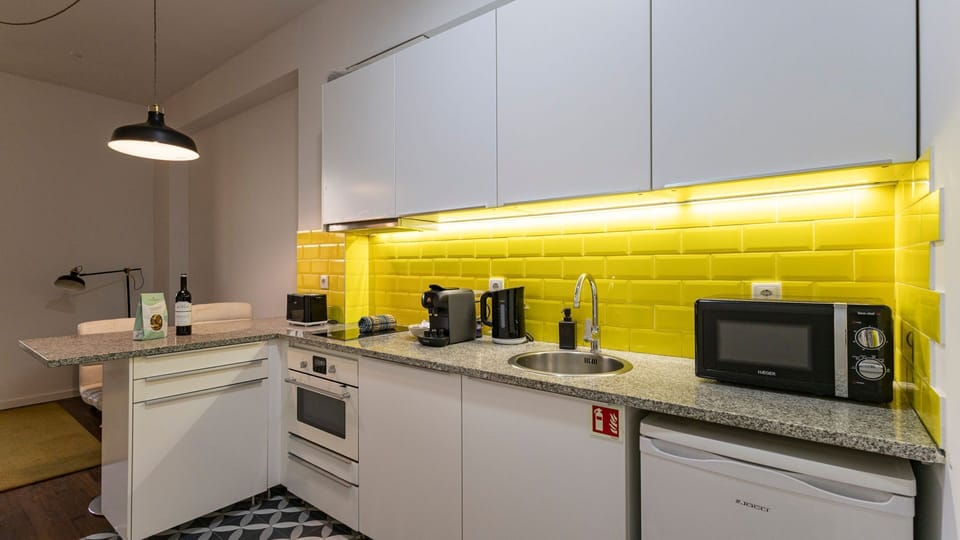 With modern appliances and tasteful design, our kitchenette is the perfect space to cook a delicious snack #practical #colorful