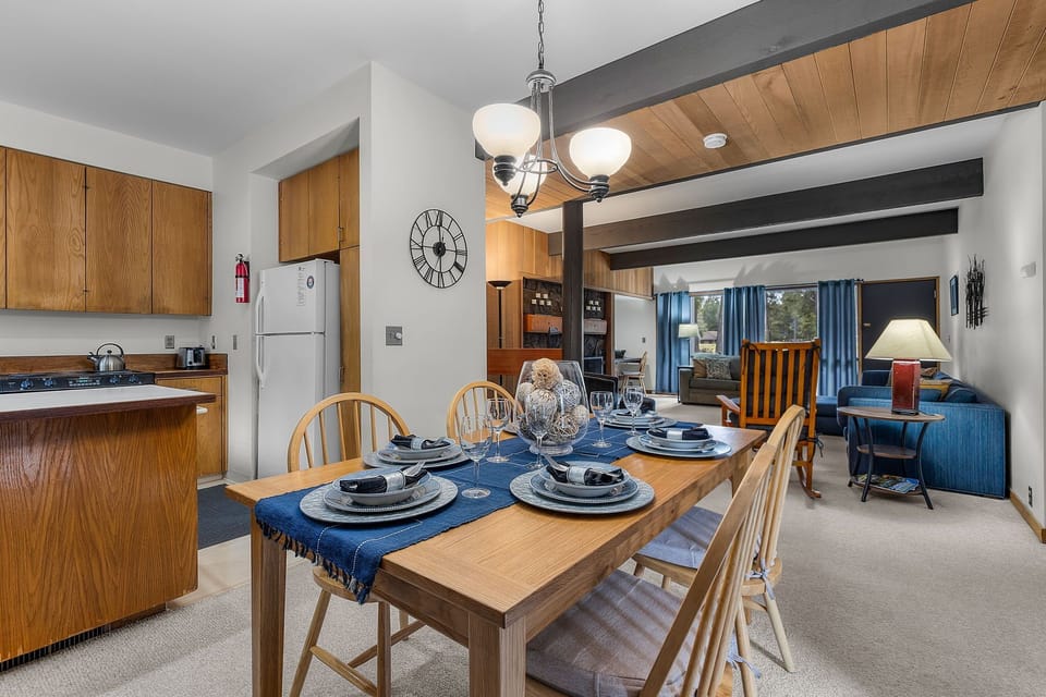 Your open-plan living space combines rustic charm with modern comfort, featuring warm wood beams and a fully-equipped kitchen perfect for home-cooked meals.