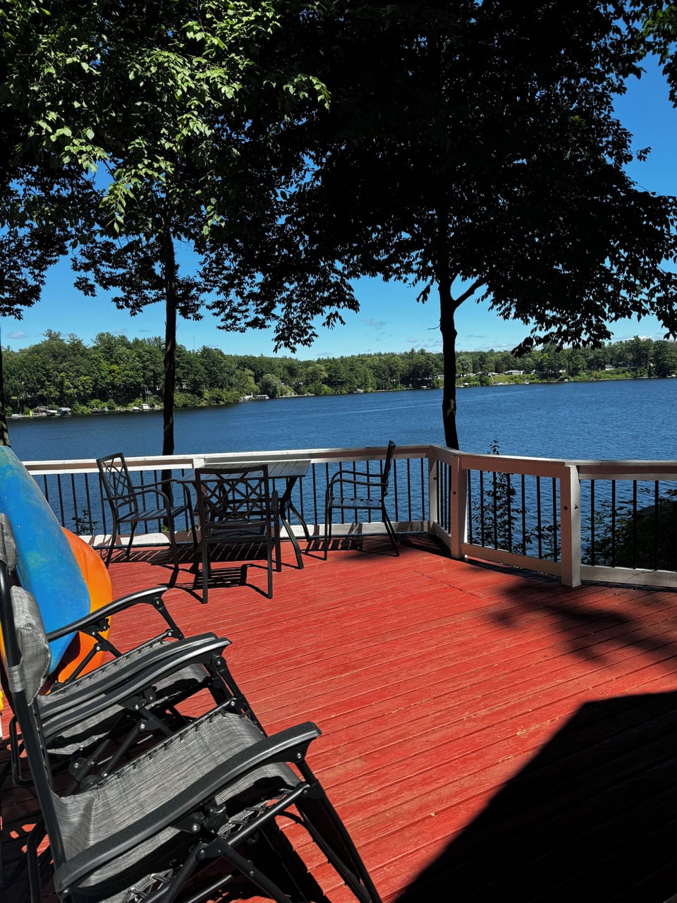 Waterfront deck with amazing view, propane grill, dining table & lounge chairs.