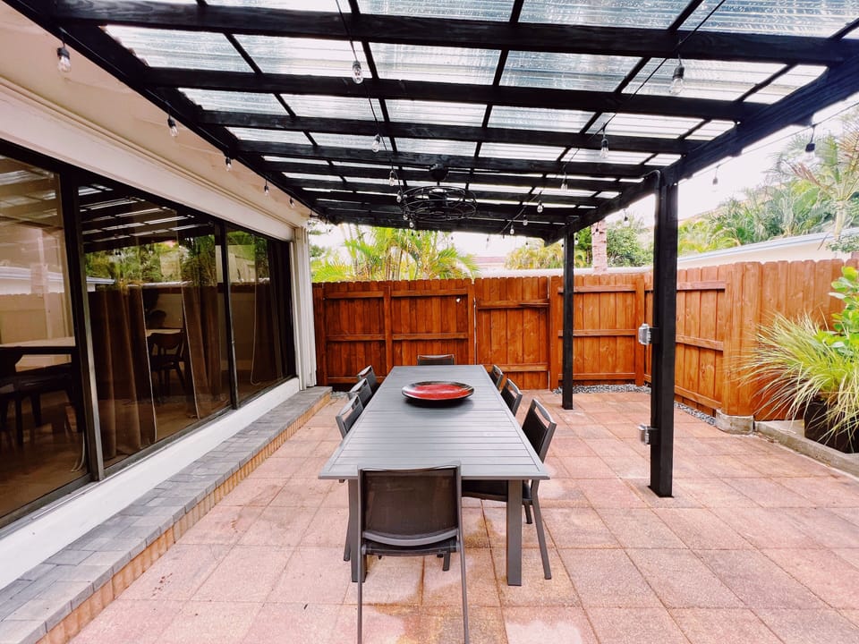 The Backyard

A large backyard full of Lucious greenery all around. The backyard has an outdoor table for all guests, 6 lounge chairs to soak in the sun, a fire place, and an above the ground pool to stay cool year around.
