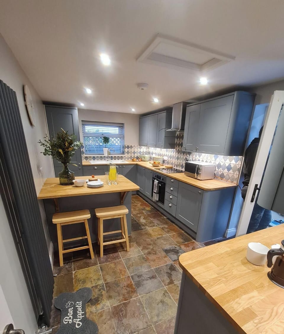 Generously sized kitchen with utensils and appliances