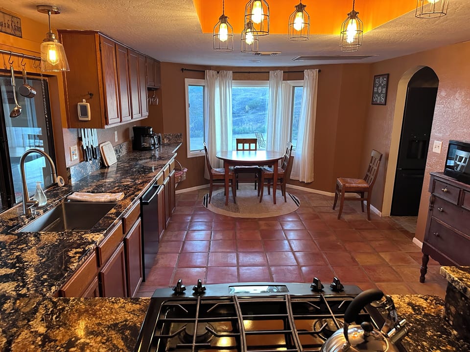Our spacious kitchen has a gas range, coffee bar, and breakfast nook.