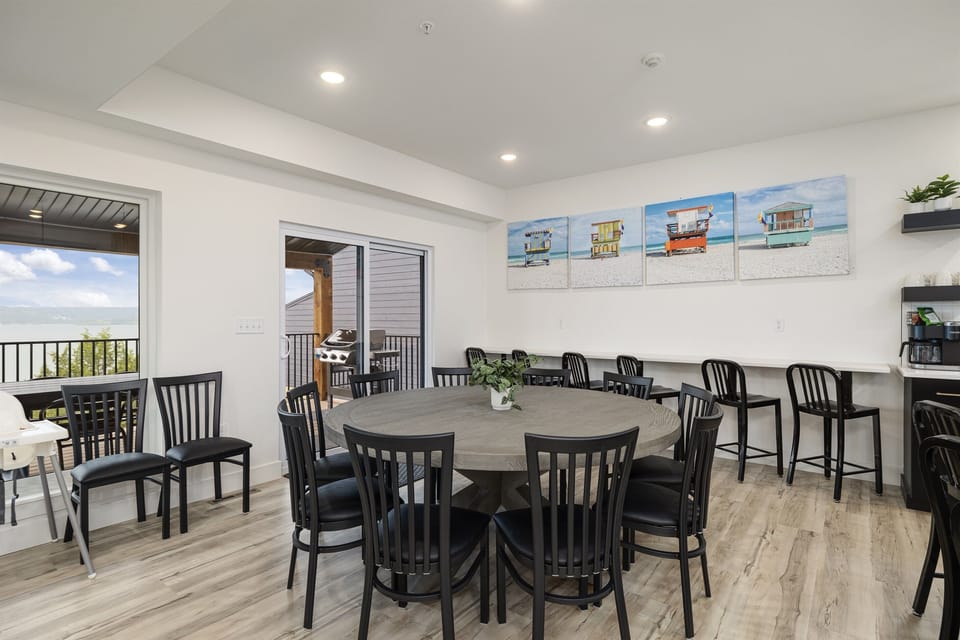 Main Level: Dining Room seating 10 at table and 9 at bar counters