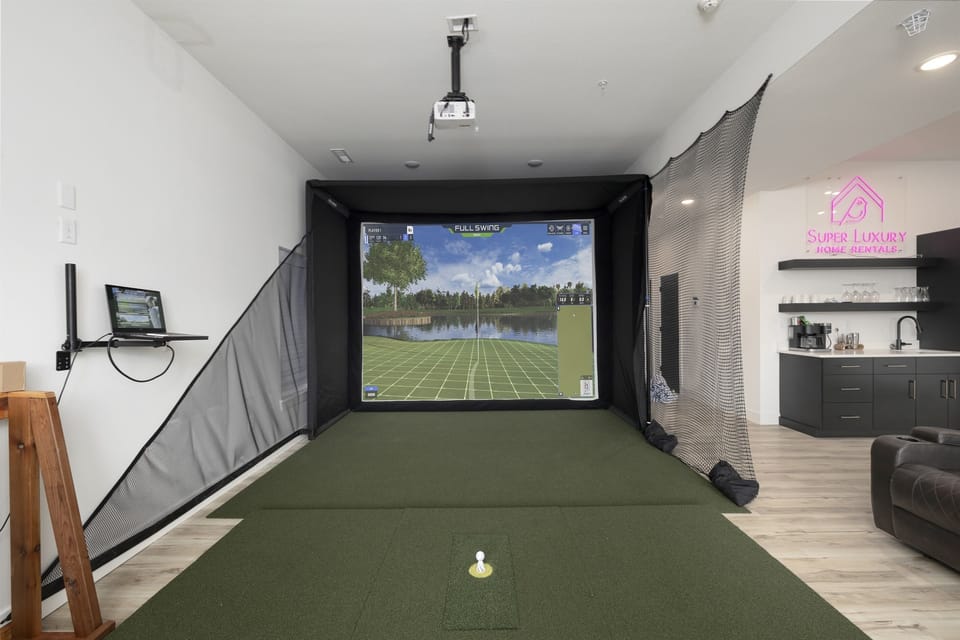 Basement Level: Family & Game Room w/ golf simulator, putting green, and pop-a-shot