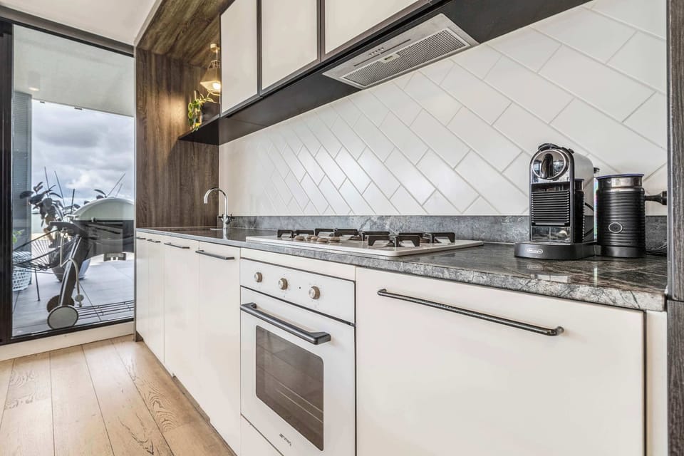KITCHEN: A culinary dream outfitted with sleek appliances and all the essentials for effortless cooking.