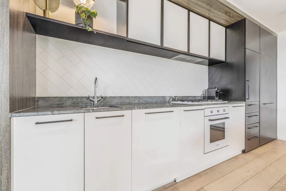 KITCHEN: A culinary dream outfitted with sleek appliances and all the essentials for effortless cooking.