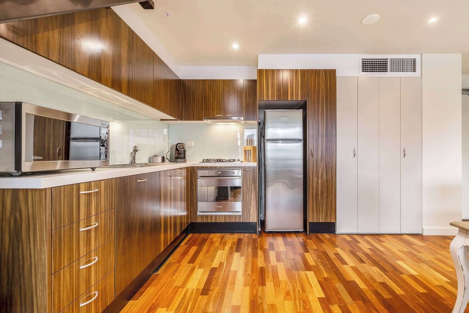 Sleek kitchen design with stainless steel finishes, blending functionality and style