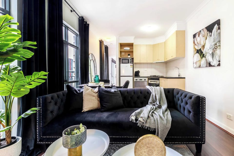 Living Room and Kitchenette at Monet: Stylish and cozy apartment with modern décor, a spacious living area, and a fully equipped kitchen, perfect for relaxing or entertaining during your stay