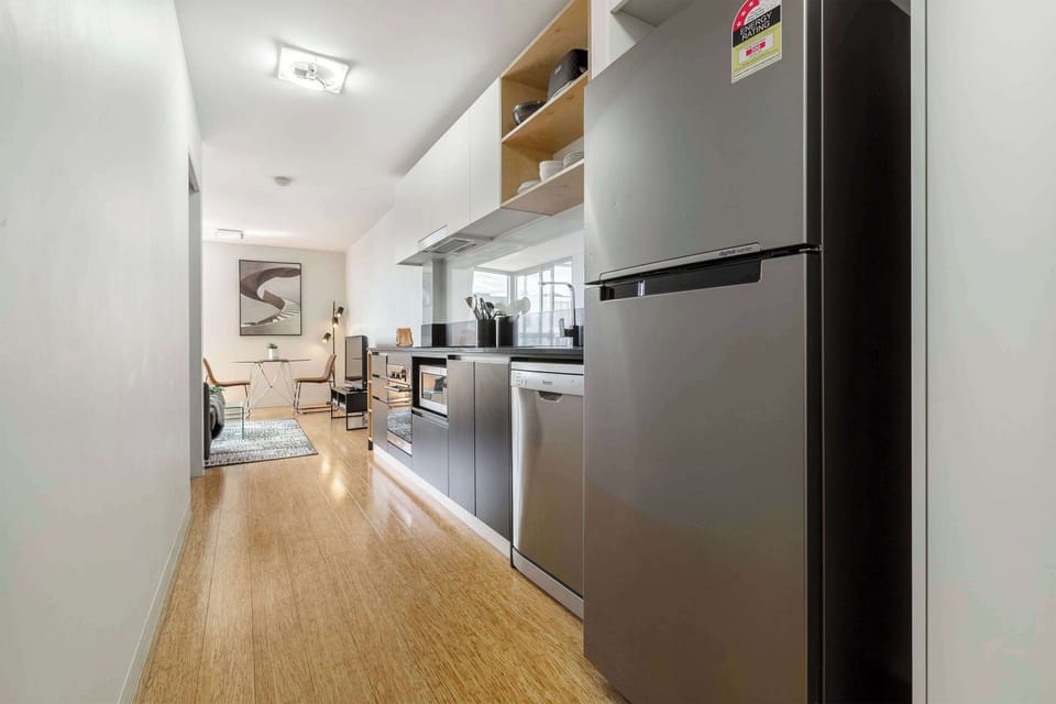 Open-plan kitchen flowing into the living area, offering convenience and comfort