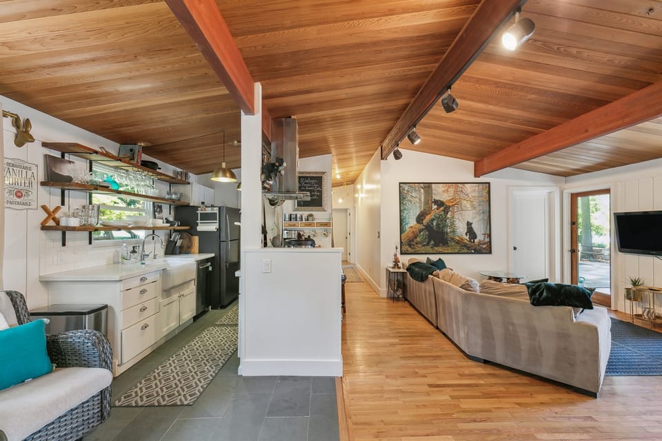 Beautiful vaulted tongue and groove ceilings throughout the home stay true to it's midcentury roots.