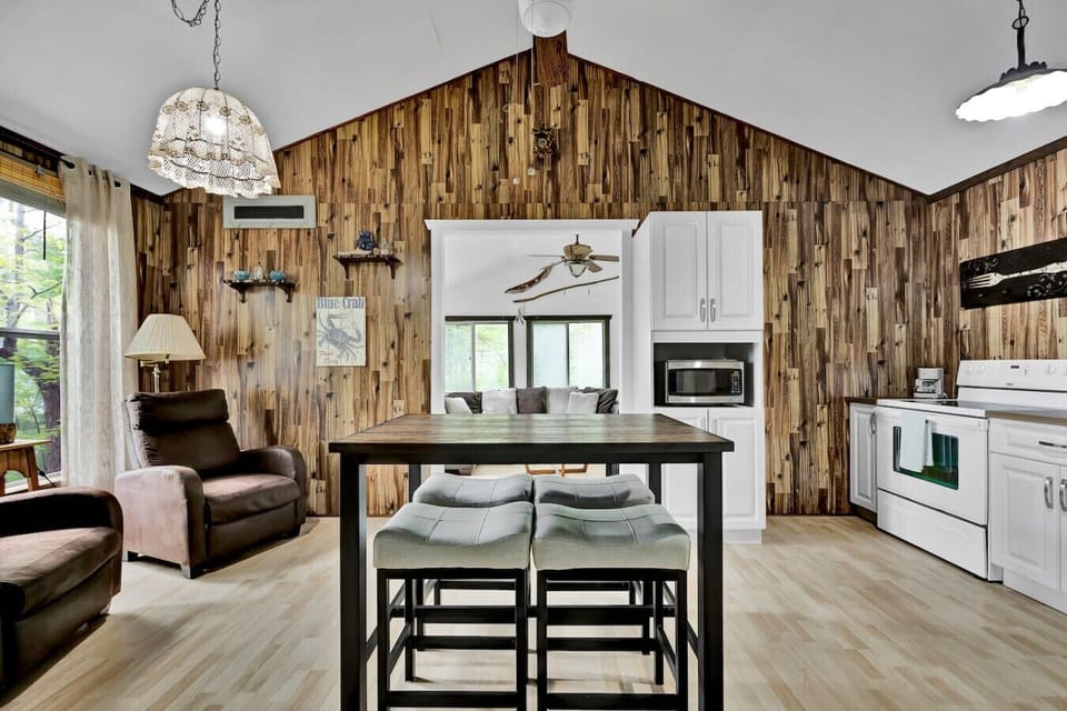 Spacious kitchen and dining area flowing into the cozy living room.