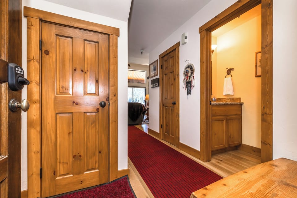 View from front door. Half bath and on the right and laundry on the right.  