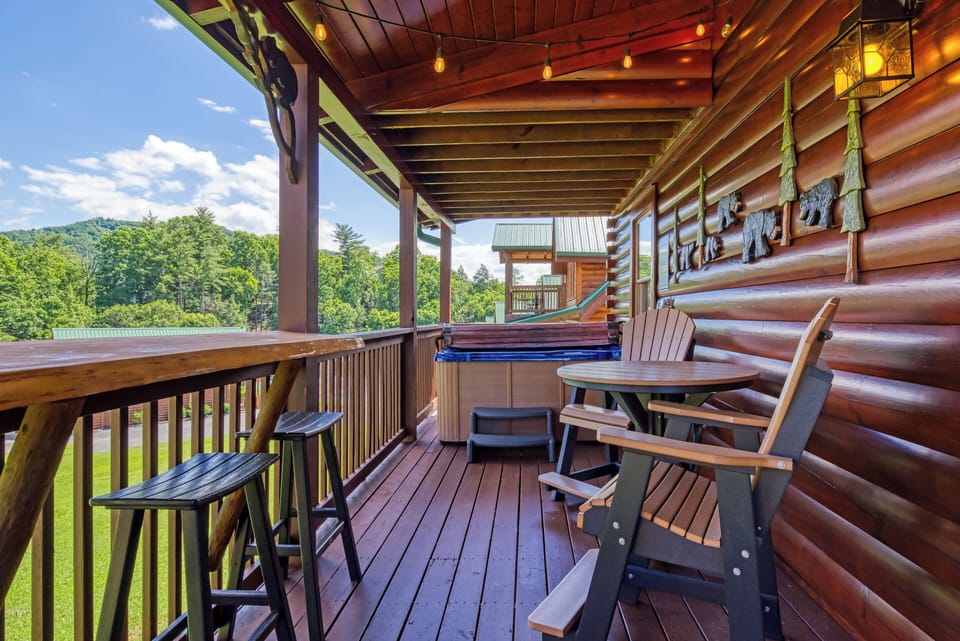 Cabin with a Hot Tub in the Smoky Mountains "A Stone's Throw" - Covered back deck with high top table and chairs