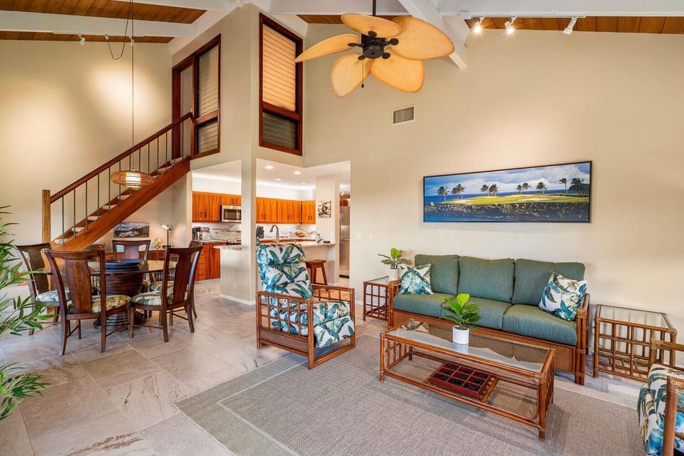 The airy and open floor plan, connecting the living area, dining space, and kitchen seamlessly.