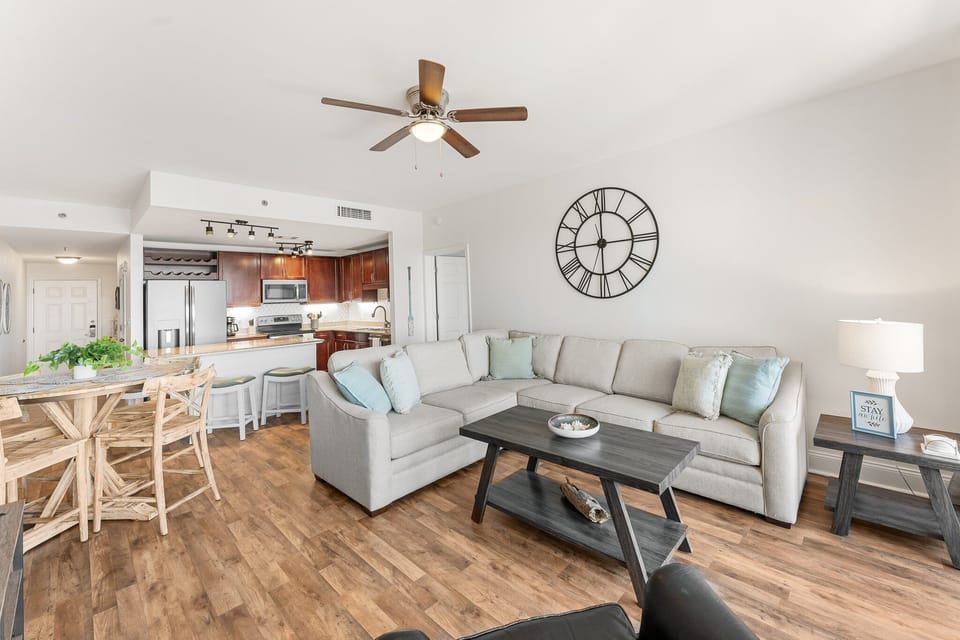 Open-concept living area with a modern kitchen and comfortable seating.