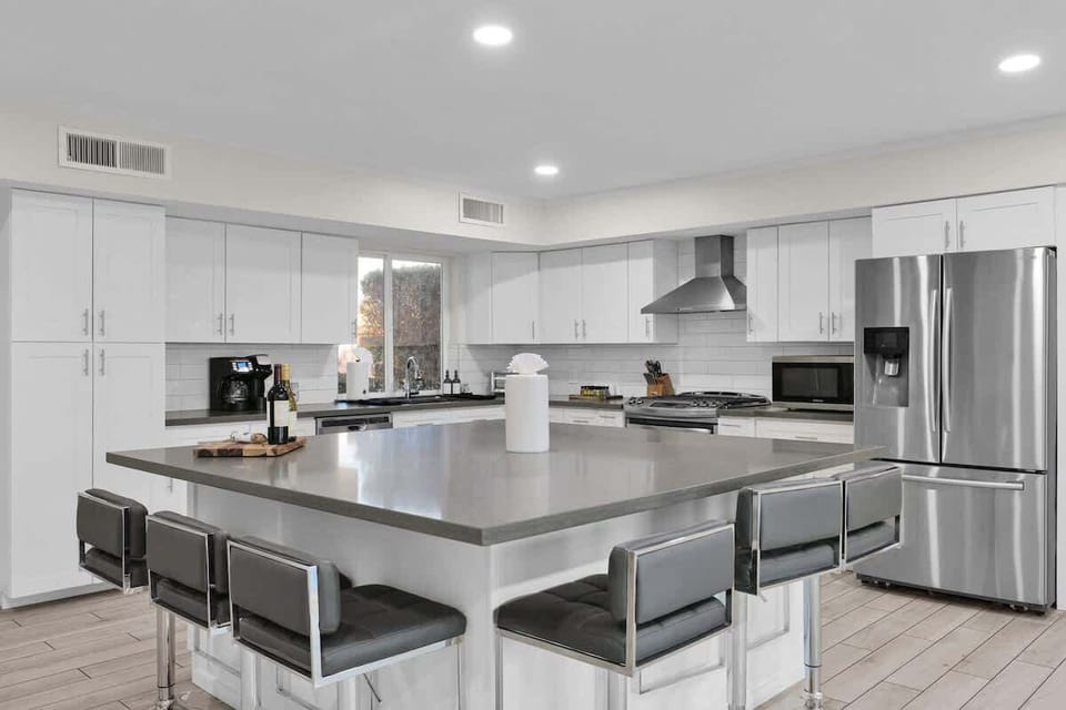 Modern gourmet kitchen with island seating for memorable meals.