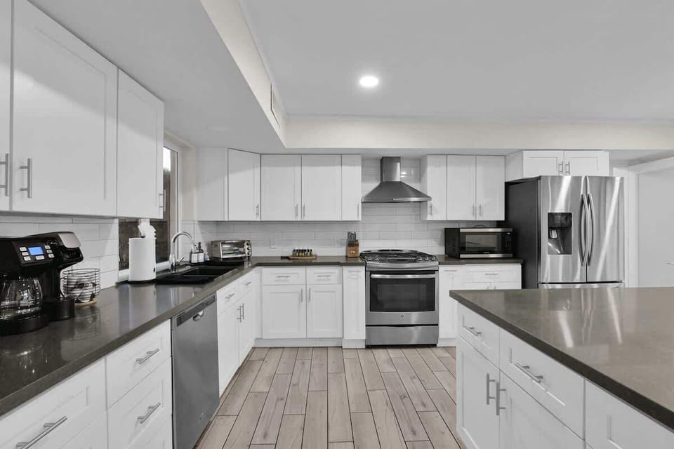 Experience our sleek, fully equipped gourmet kitchen for memorable meals!