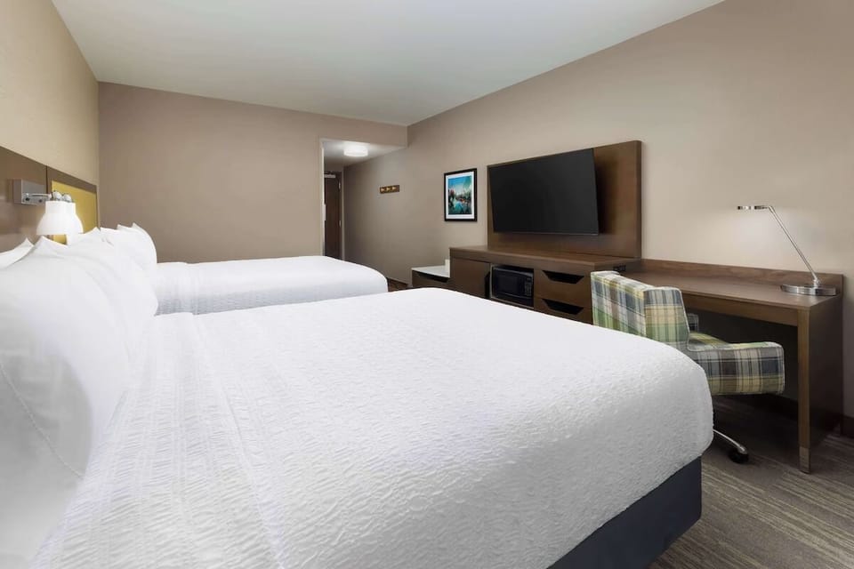 Relax together with spacious double beds and easy in-room storage.