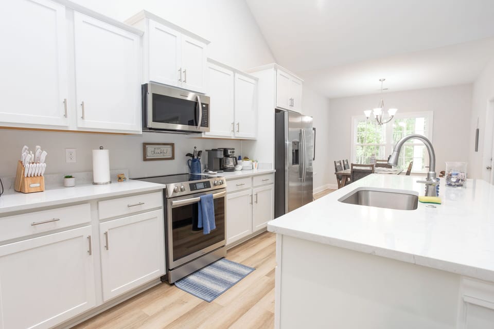 Enjoy a stylish kitchen with sleek appliances, ample counter space, and all the essentials for a home-cooked meal.