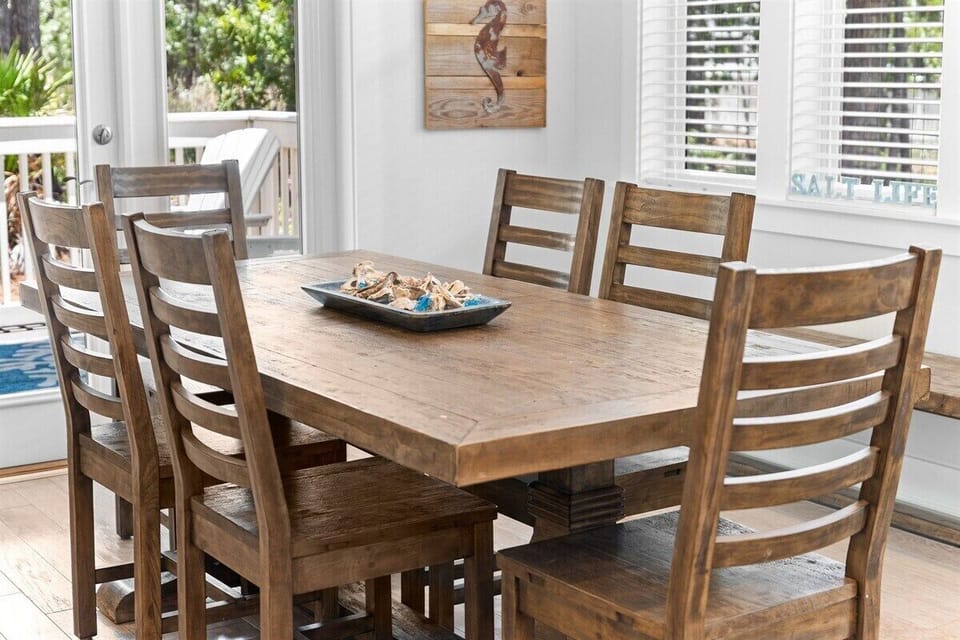 A cozy dining setup with a farmhouse-style table and modern decor, creating a perfect vacation vibe.