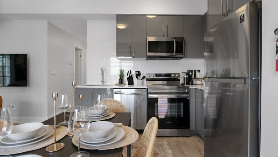 Featuring sleek stainless steel appliances, ample storage with easy-to-reach cabinets, and a spacious layout perfect for preparing meals together.  It offers all the space and tools you need to make mealtime a fun and effortless part of your day!