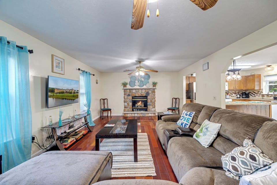 The living room features a cozy sectional sofa, smart TV, and free wifi!