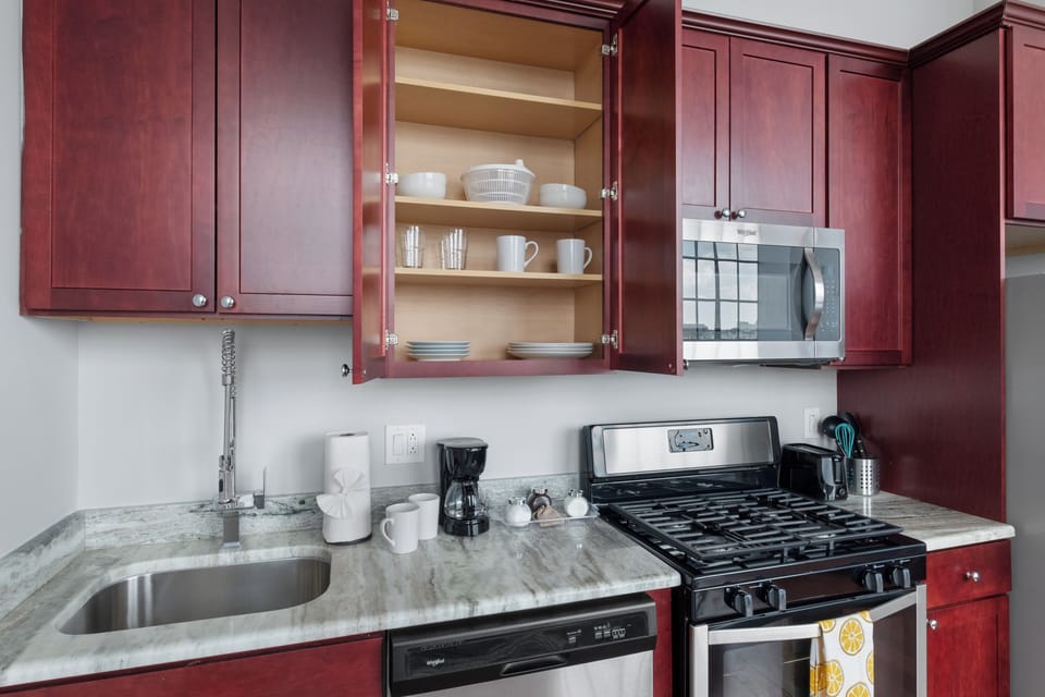 Ample counter space and open shelving for easy meal preparation and storage.