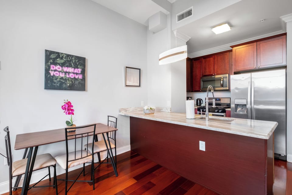 Kitchen and dining space with cherry cabinetry and open layout offering functional area for entertaining.