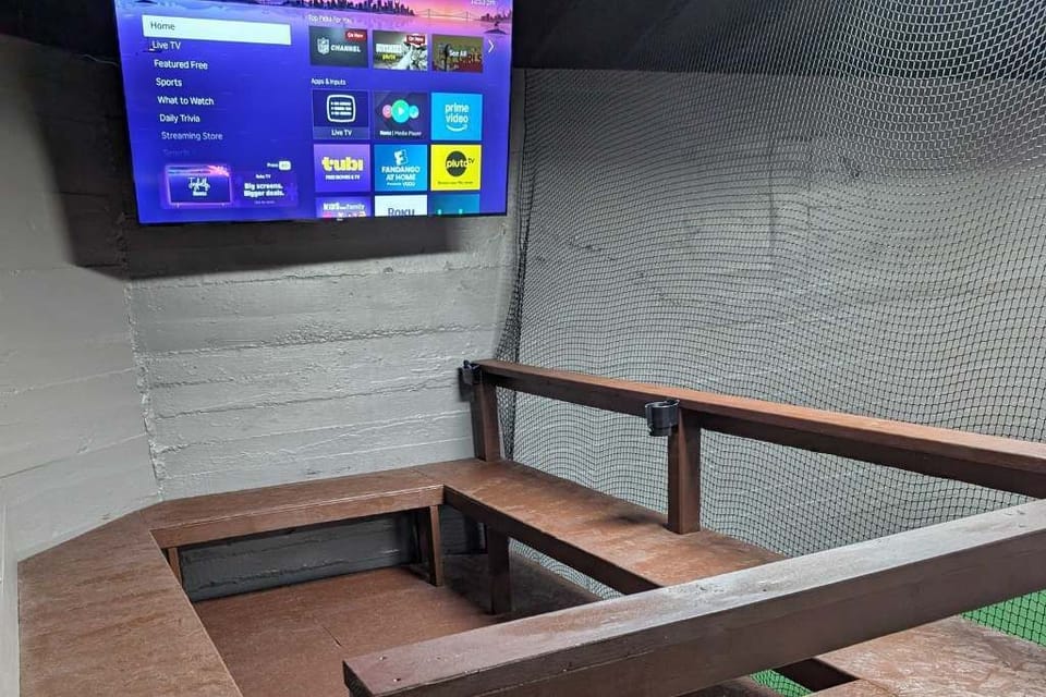 Seats with Roku TV in pickleball court. 