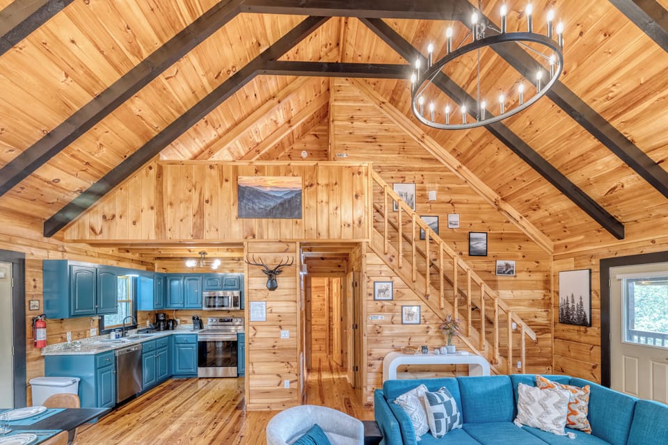 Stairs leading to upper floor king bedroom with en-suite shower