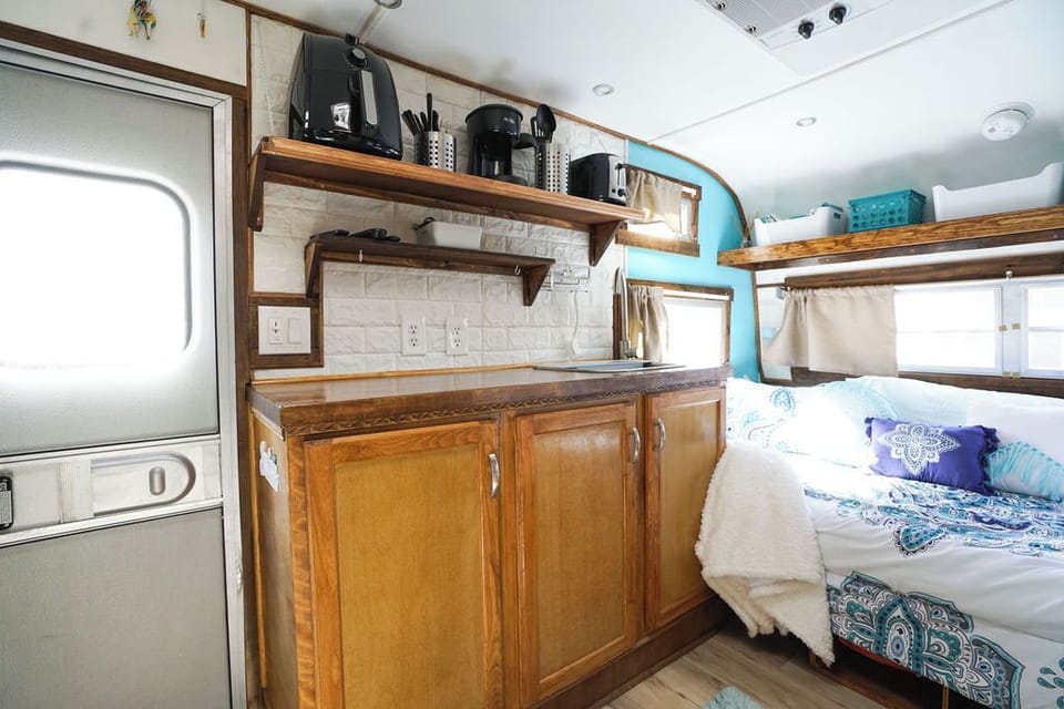 Kitchen and bed with shelving